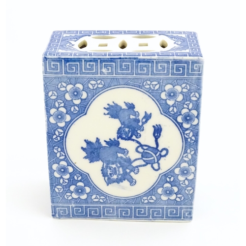 12 - A Chinese blue and white flower brick decorated with foo dogs / guardian lions and flower blossom. A... 