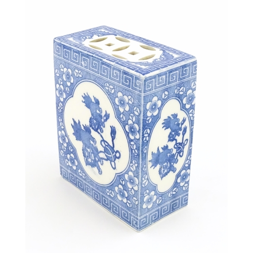 12 - A Chinese blue and white flower brick decorated with foo dogs / guardian lions and flower blossom. A... 