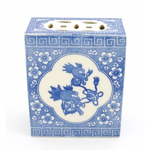 12 - A Chinese blue and white flower brick decorated with foo dogs / guardian lions and flower blossom. A... 