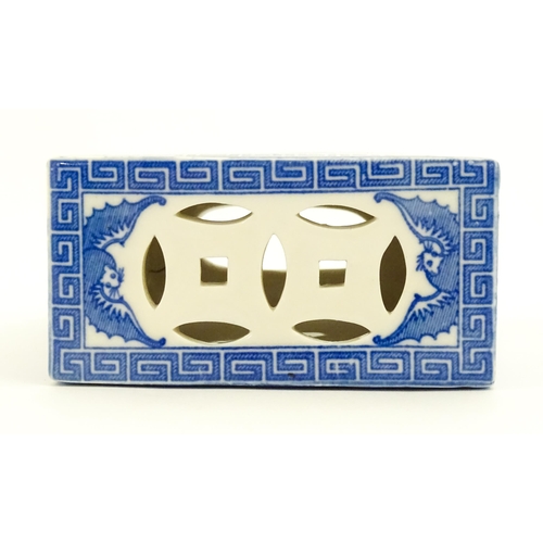 12 - A Chinese blue and white flower brick decorated with foo dogs / guardian lions and flower blossom. A... 