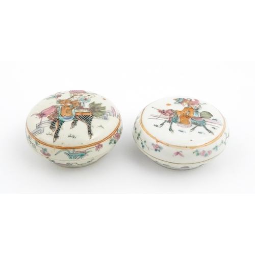 13 - Two Chinese famille rose ink boxes of circular form decorated with two figures riding Longma the win... 