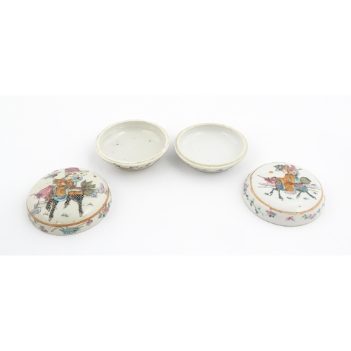 13 - Two Chinese famille rose ink boxes of circular form decorated with two figures riding Longma the win... 