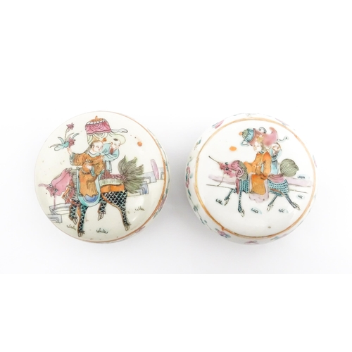 13 - Two Chinese famille rose ink boxes of circular form decorated with two figures riding Longma the win... 