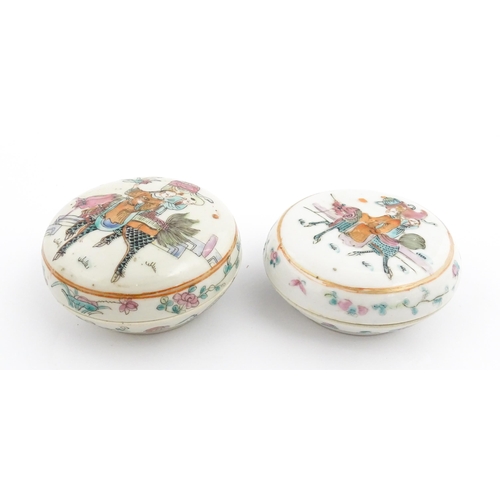 13 - Two Chinese famille rose ink boxes of circular form decorated with two figures riding Longma the win... 