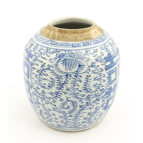 14 - A Chinese blue and white jar with brushwork decoration depicting flowers and foliage. Approx. 8 1/2