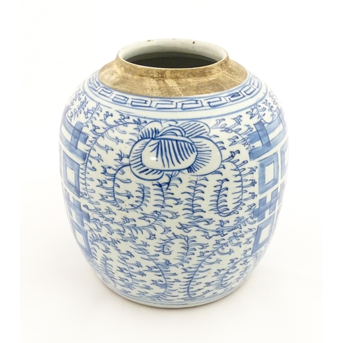 14 - A Chinese blue and white jar with brushwork decoration depicting flowers and foliage. Approx. 8 1/2