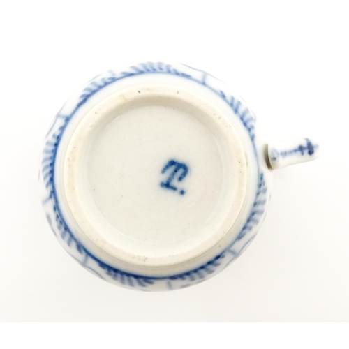 19 - Four Chinese items to include a famille rose brush washer with Character script detail, a blue and w... 