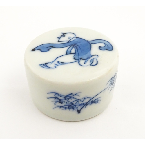 19 - Four Chinese items to include a famille rose brush washer with Character script detail, a blue and w... 