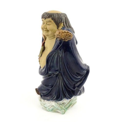 25 - An Oriental model of a Buddha / male figure with auspicious symbol and frog to shoulder. Approx. 9 3... 