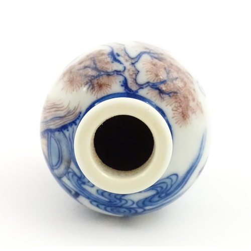 36 - A small Chinese blue and white vase depicting figures in a landscape. Approx. 2 3/4