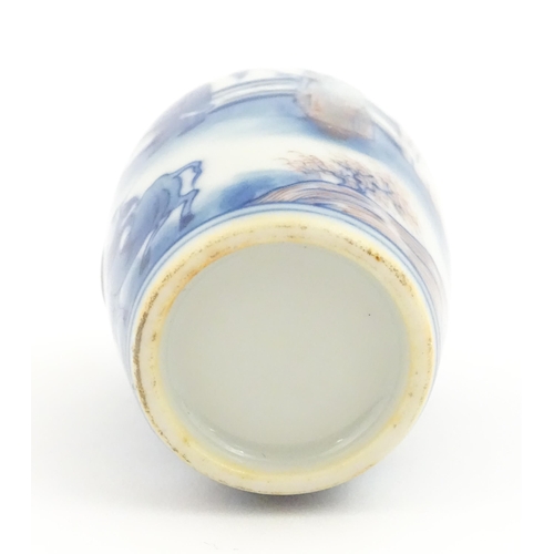 36 - A small Chinese blue and white vase depicting figures in a landscape. Approx. 2 3/4