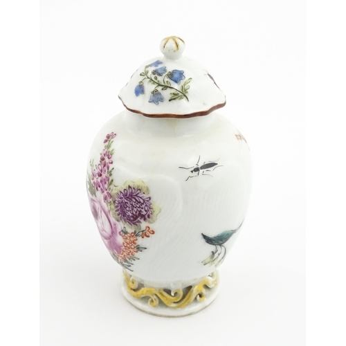 4 - A Chinese tea caddy / canister of vase and cover form with hand painted decoration depicting flowers... 