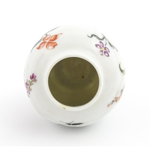 4 - A Chinese tea caddy / canister of vase and cover form with hand painted decoration depicting flowers... 