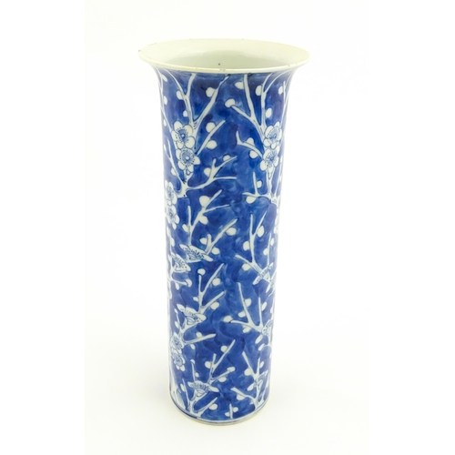 5 - A Chinese blue and white vase of cylindrical vase decorated with prunus blossom. Character marks und... 