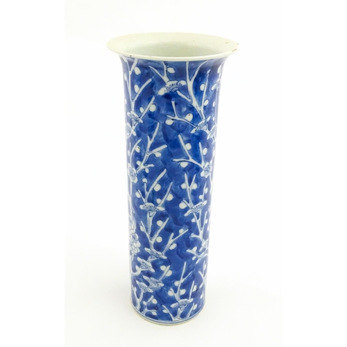 5 - A Chinese blue and white vase of cylindrical vase decorated with prunus blossom. Character marks und... 