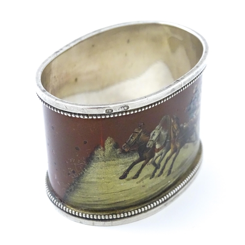 347 - A Russian silver napkin ring with lacquered and hand painted decoration depicting figures in a troik... 