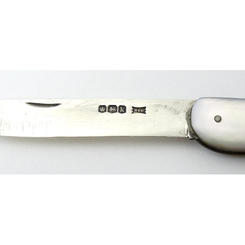 349 - A silver folding fruit knife with mother of pearl handle, hallmarked Sheffield 1927, maker Walker & ... 