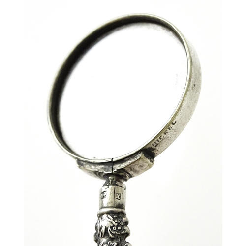 351 - A small silver handled magnifying glass. Approx. 3 1/2