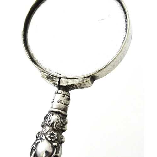 351 - A small silver handled magnifying glass. Approx. 3 1/2