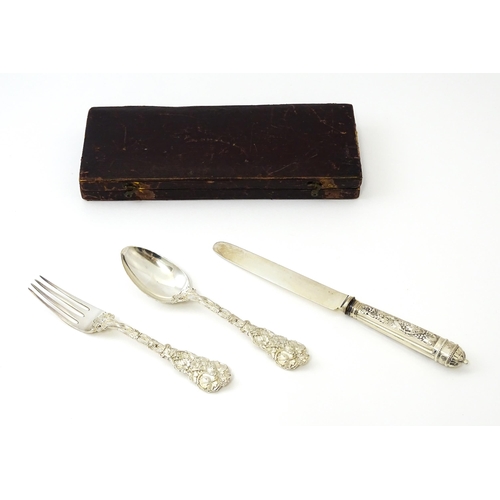 352 - A cased George IV silver three piece Christening set comprising knife, fork and spoon, with fruiting... 