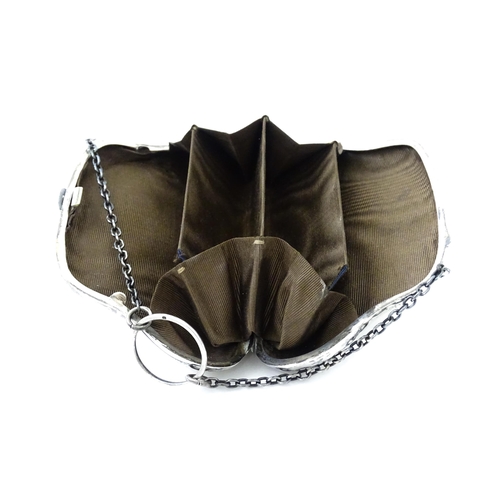 353 - A silver purse with engraved decoration and hanging chain, hallmarked Birmingham 1907. Approx. 4 1/2... 