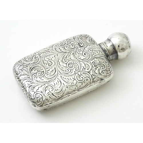 355 - A Victorian silver scent bottle / perfume flask with engraved decoration hallmarked Chester 1894, ma... 