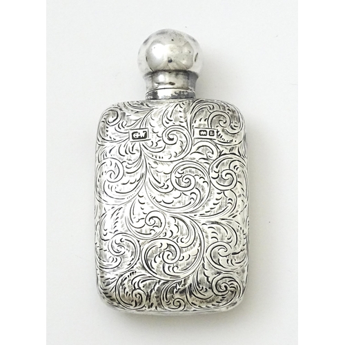 355 - A Victorian silver scent bottle / perfume flask with engraved decoration hallmarked Chester 1894, ma... 