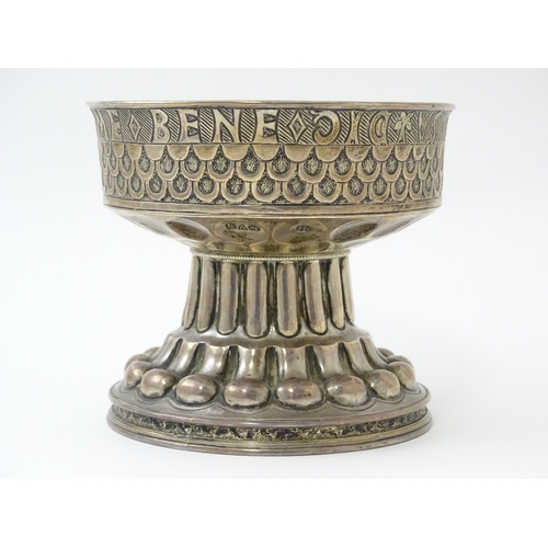 359 - A silver replica of the Tudor cup (Holms cup) of font shape with raised and chased repousse circular... 