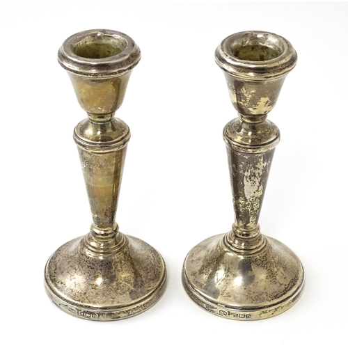 361 - A pair of small silver candlesticks hallmarked Birmingham 1978, maker William Adams Ltd. Approx. 5