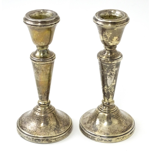 361 - A pair of small silver candlesticks hallmarked Birmingham 1978, maker William Adams Ltd. Approx. 5