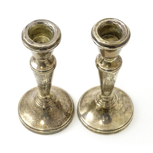 361 - A pair of small silver candlesticks hallmarked Birmingham 1978, maker William Adams Ltd. Approx. 5