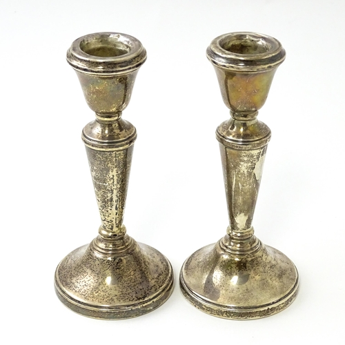 361 - A pair of small silver candlesticks hallmarked Birmingham 1978, maker William Adams Ltd. Approx. 5