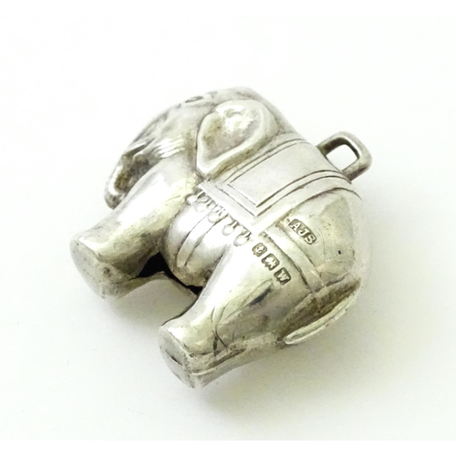 368 - A silver baby's rattle of elephant form, hallmarked Birmingham 1921, maker Arthur Johnson Smith. App... 