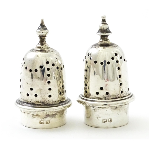 376 - A pair of silver pepperettes hallmarked Birmingham 1912, maker William Hutton & Sons Ltd. Approx. 4