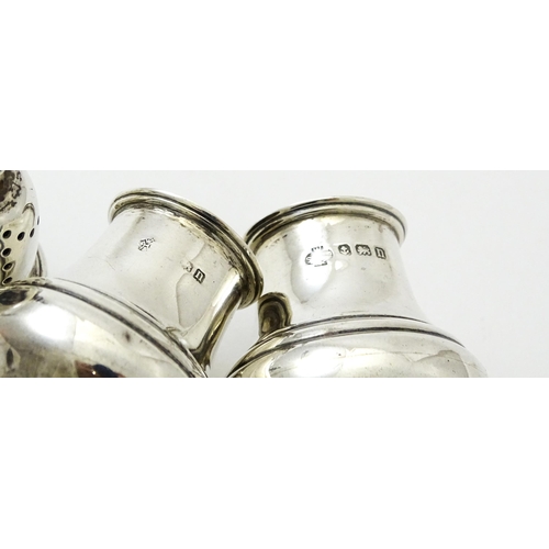 376 - A pair of silver pepperettes hallmarked Birmingham 1912, maker William Hutton & Sons Ltd. Approx. 4