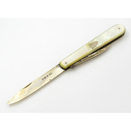 378 - A Victorian silver twin blade folding fruit knife with mother of pearl handle hallmarked Sheffield 1... 