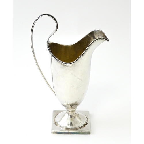 380 - A Victorian silver helmet cream jug, hallmarked Birmingham 1894, maker John Edward Wilmot. Approx. 6... 