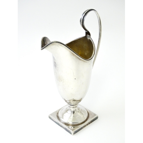 380 - A Victorian silver helmet cream jug, hallmarked Birmingham 1894, maker John Edward Wilmot. Approx. 6... 