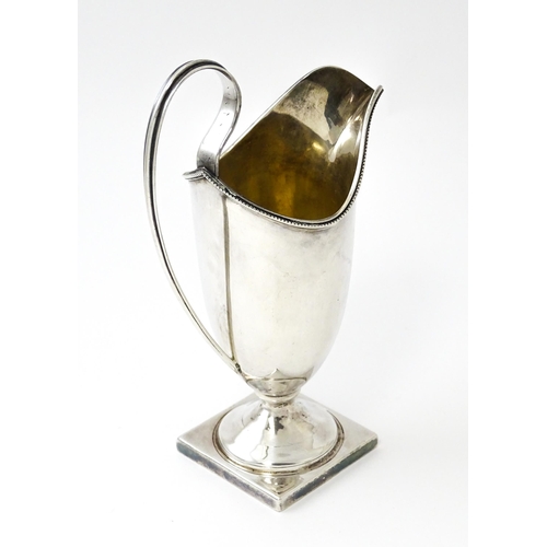 380 - A Victorian silver helmet cream jug, hallmarked Birmingham 1894, maker John Edward Wilmot. Approx. 6... 