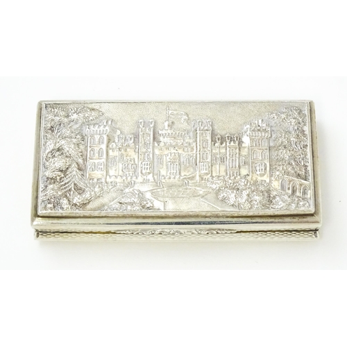 381 - A Victorian silver castle top snuff box the lid with relief decoration depicting Windsor Castle, the... 