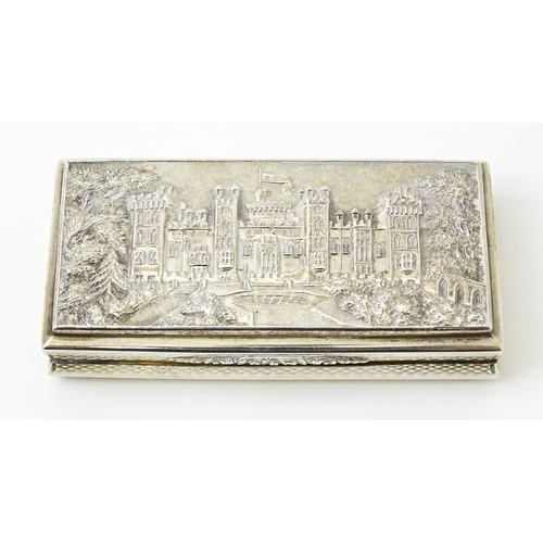 381 - A Victorian silver castle top snuff box the lid with relief decoration depicting Windsor Castle, the... 