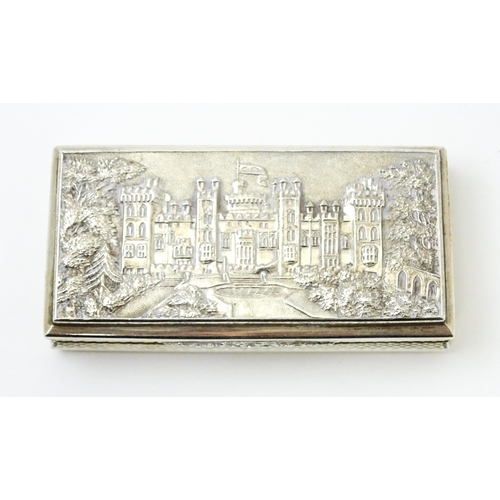 381 - A Victorian silver castle top snuff box the lid with relief decoration depicting Windsor Castle, the... 