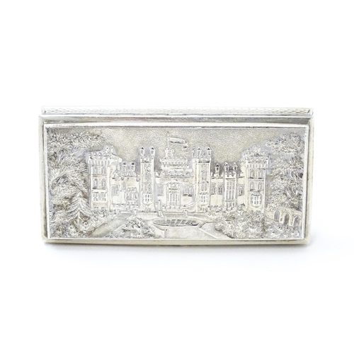 381 - A Victorian silver castle top snuff box the lid with relief decoration depicting Windsor Castle, the... 