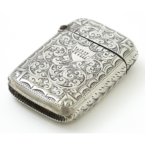 383 - A Victorian silver vesta case with engraved acanthus scroll decoration, hallmarked Birmingham 1890, ... 