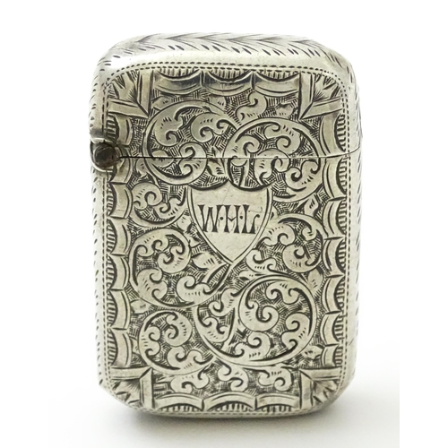 383 - A Victorian silver vesta case with engraved acanthus scroll decoration, hallmarked Birmingham 1890, ... 