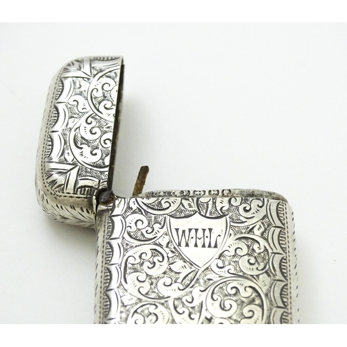 383 - A Victorian silver vesta case with engraved acanthus scroll decoration, hallmarked Birmingham 1890, ... 