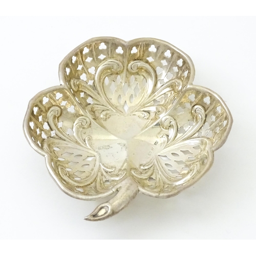 384 - A silver bon bon dish formed as a clover leaf with pierced decoration, hallmarked Birmingham 1901. m... 