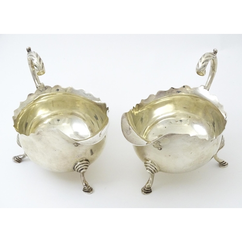 386 - A pair of silver sauce boats hallmarked Sheffield 1926, maker Thomas Bradbury & Sons Ltd. Approx. 5 ... 