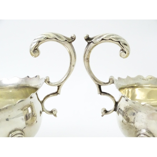 386 - A pair of silver sauce boats hallmarked Sheffield 1926, maker Thomas Bradbury & Sons Ltd. Approx. 5 ... 