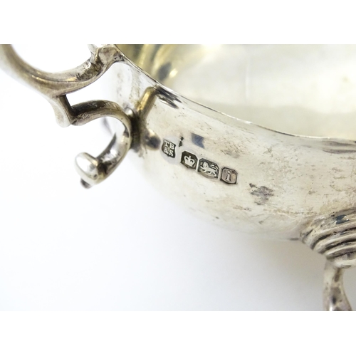 386 - A pair of silver sauce boats hallmarked Sheffield 1926, maker Thomas Bradbury & Sons Ltd. Approx. 5 ... 